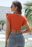 ruffled surplice cropped knit top